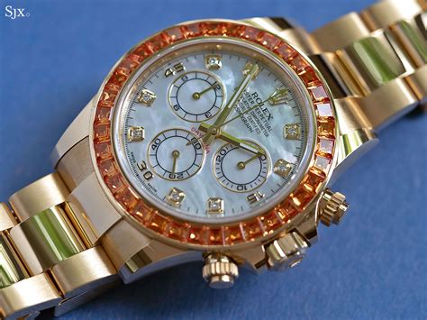 rolex daytona orange sapphires.